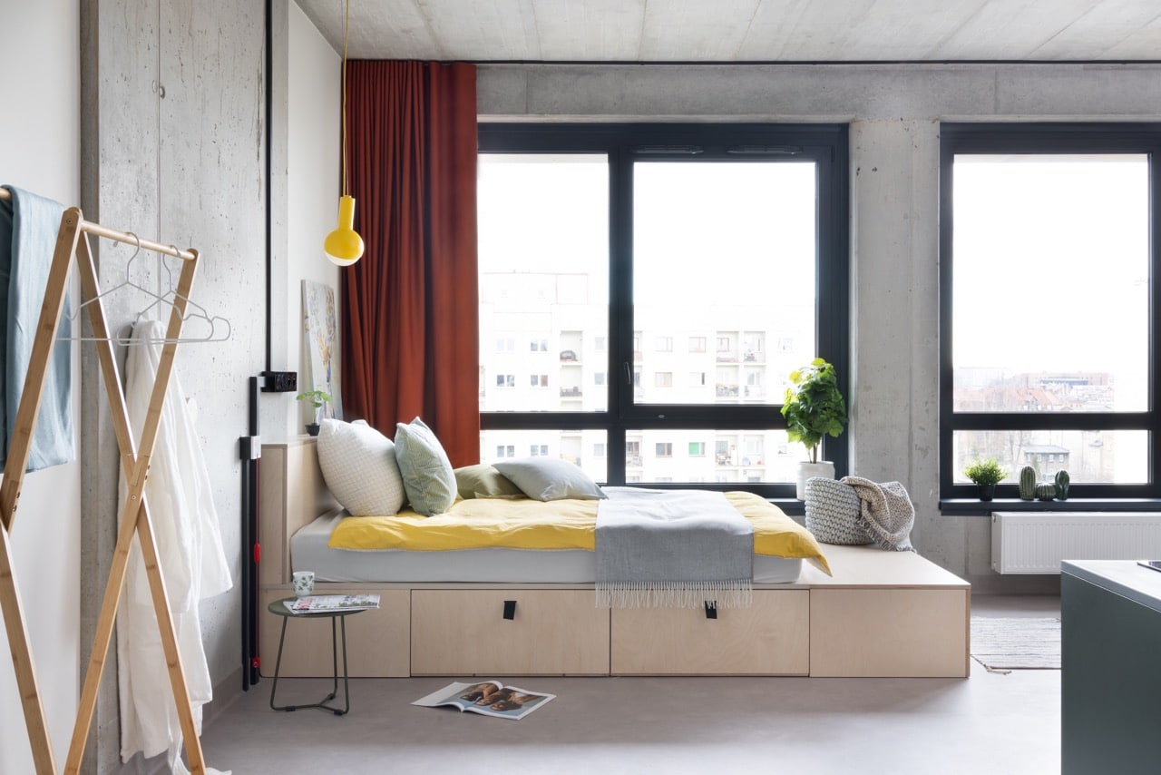 Large bed with great views and in one of the Studio rooms at Basecamp Katowice dorm